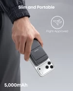 Anker MagGo power bank attached to phone held in hand showing slim profile