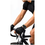 Green Lion Time Smart Watch worn by cyclist, showing black rectangular sports watch with silicone strap during outdoor cycling