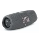 JBL Charge 5 grey portable Bluetooth speaker angled front view with JBL logo and side passive radiator