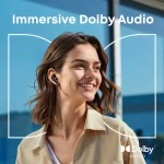 Woman wearing Soundcore Liberty 5 earbud during Dolby Audio demonstration